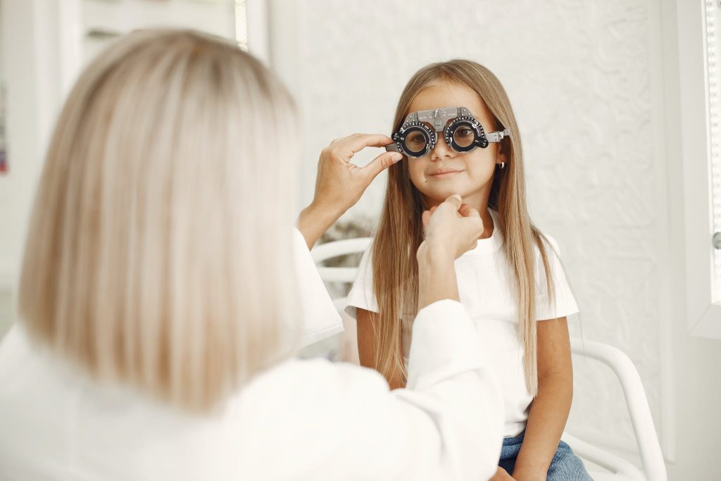 Girl Having Eye Exam at Optometrists Office